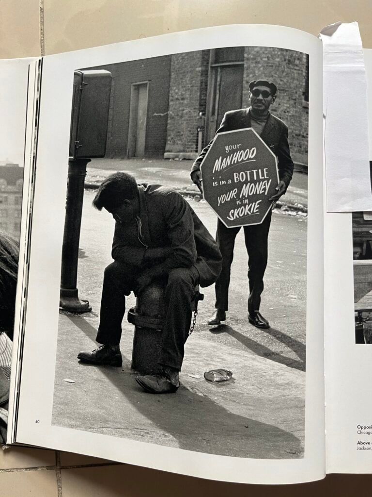 Man, man with glasses, sandwich board, street, city, bottle floor, black men, smiling, down and out, skokie