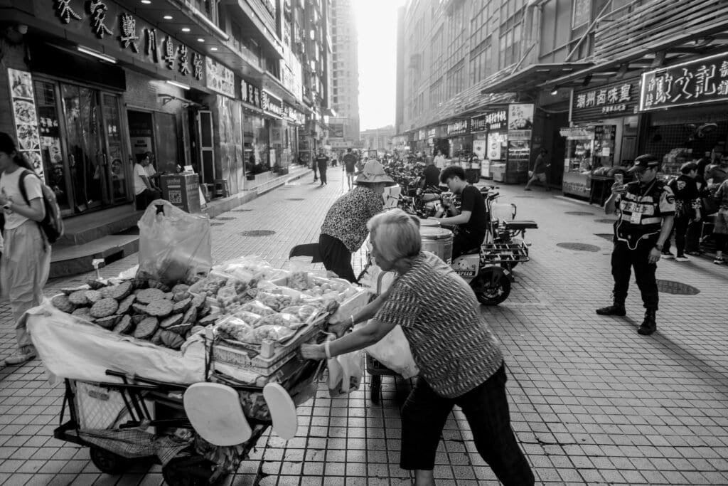 Street sellers, china, old ladies, shoppers, fruit, food, policeman