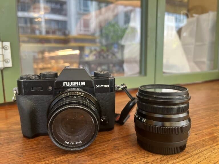FUJINON XF16mmF2.8 R WR, X-t30 and 7artisans 35mm f1.2, on wooden surface, shop front, black, window