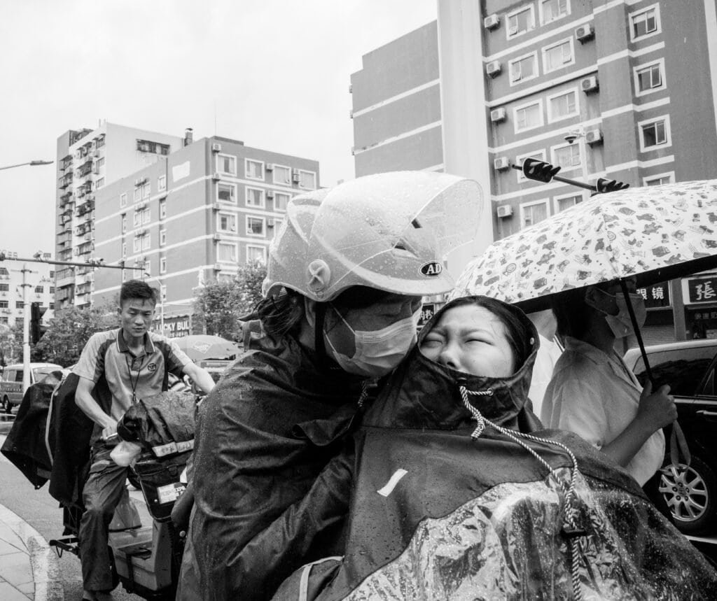 Street, bikes, mum and daughter, crying, rain, helmets, china