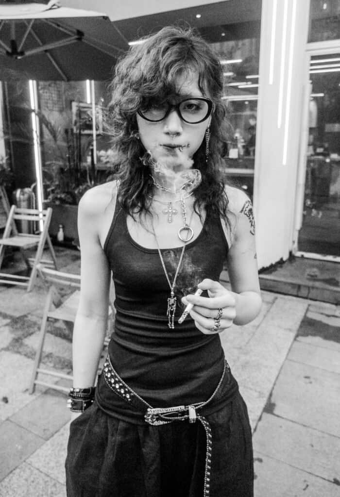 A moody punk goth rock girl Shenzhen china smokes and stares at me Taken on the fujifilm x-t30 7artisans lens 35mm
