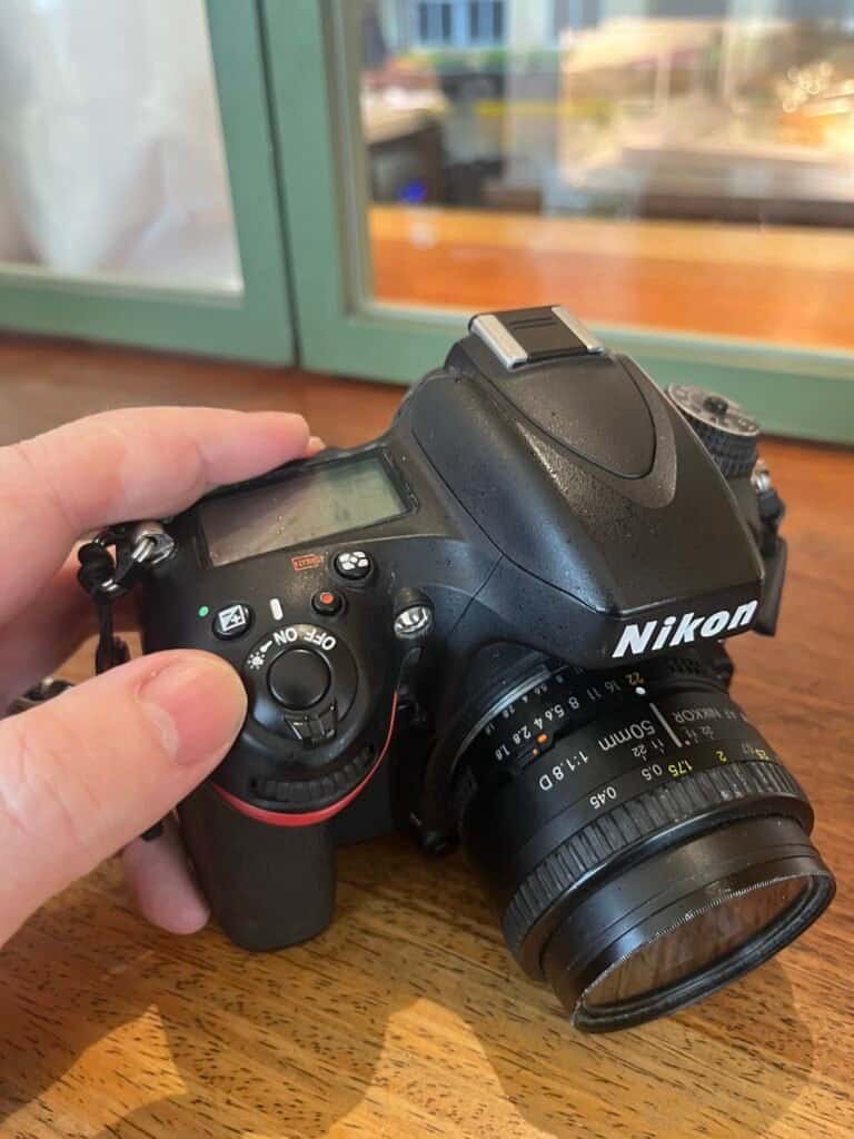 Nikon d600 view of on off button display held in hand