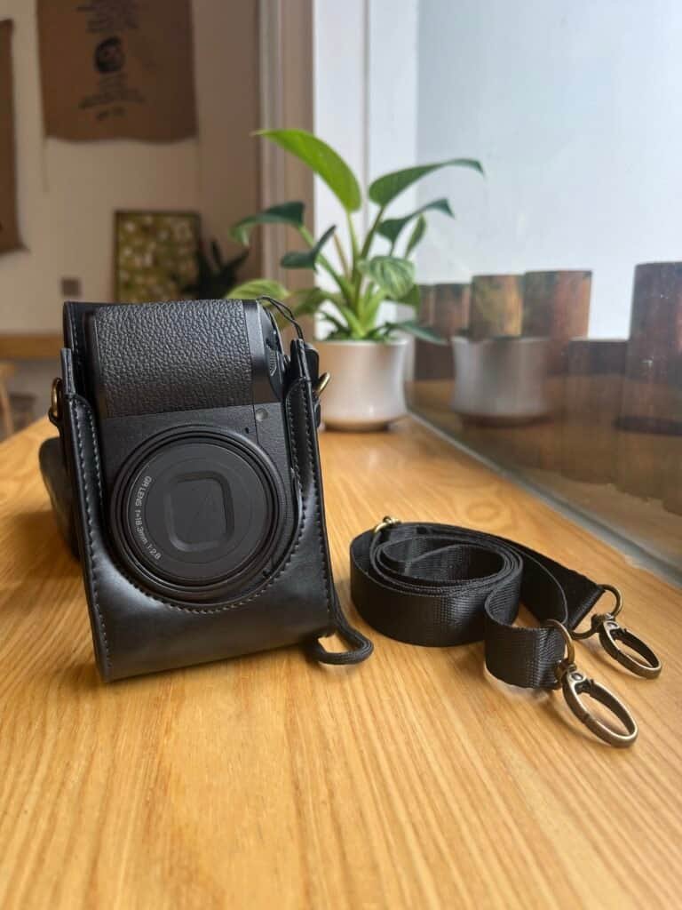 Richo gr3 with shoulder case and strap case open