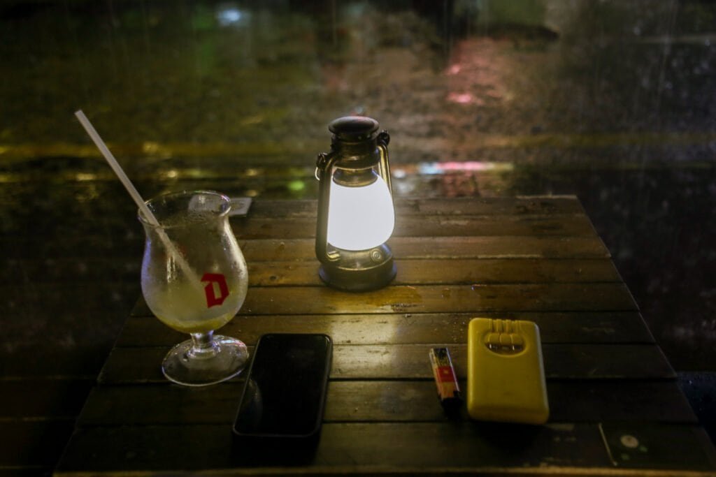 Coffee bar table light glass phone and charger in low light taken on the canon d6 mark 1 night