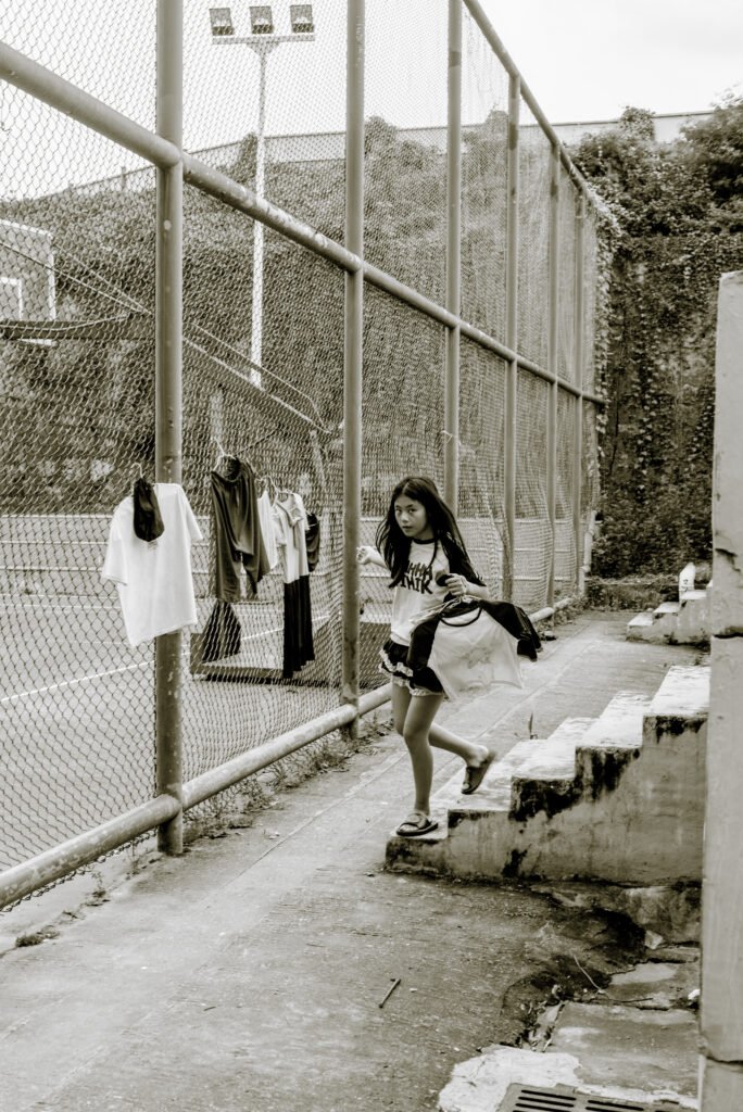 A girl runs with clothes in china shenzhen