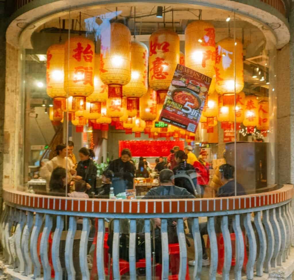 Reflection street chengdu Window street life Reflection street chengdu people walking siting china road buildings Night street restaurant China