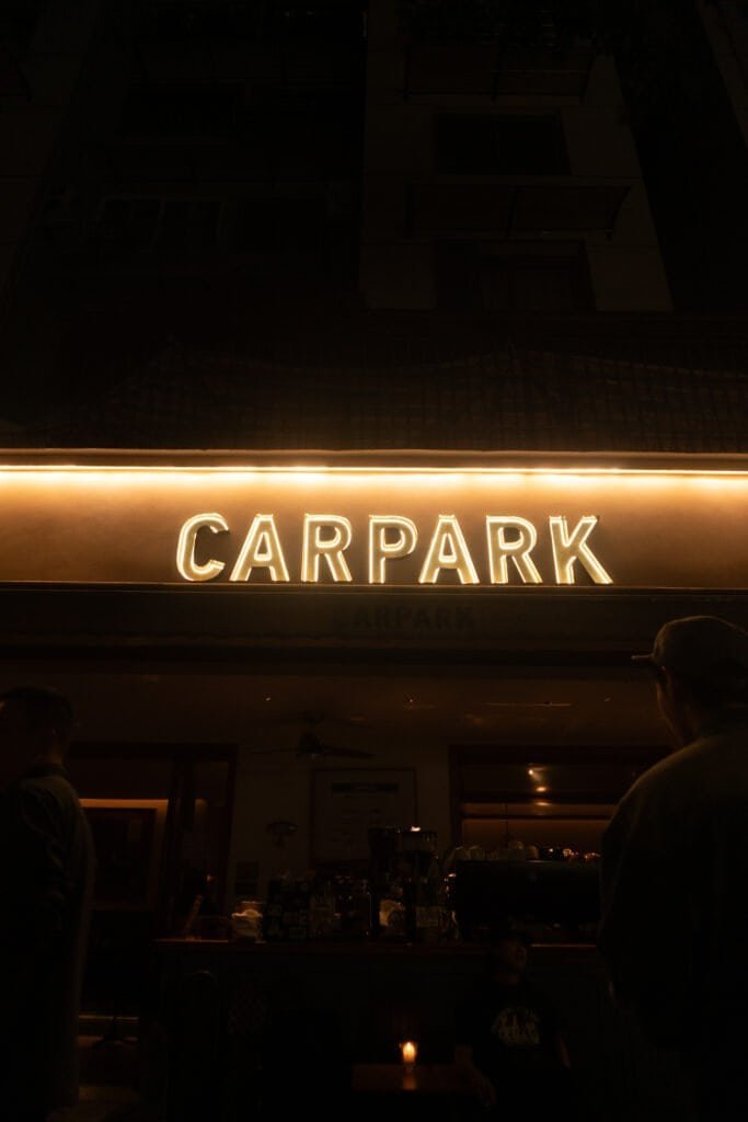 Early evening Chengdu coffee shop carpark sign people street coffee shop china sichuan song a6300