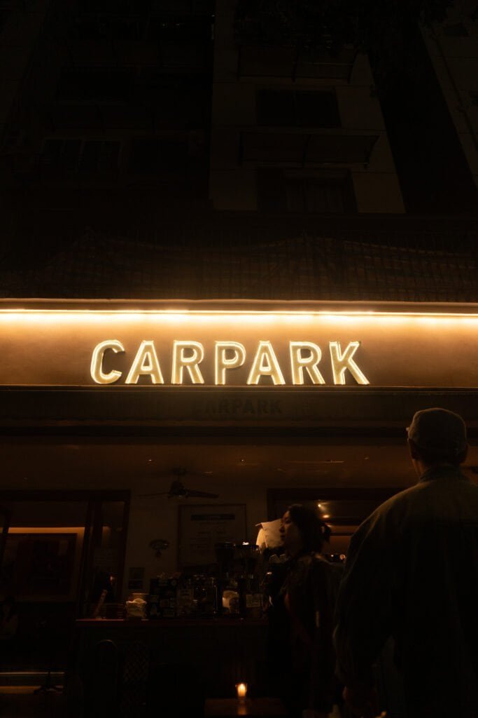 Early evening Chengdu coffee shop carpark sign people street coffee shop china sichuan song a6300