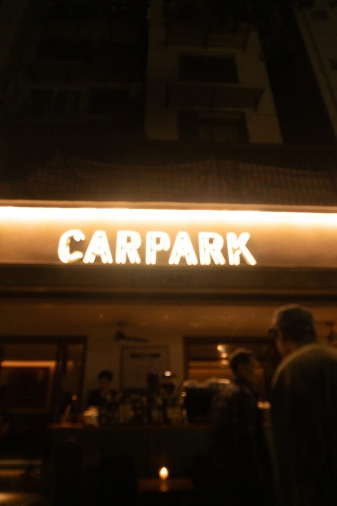 Early evening Chengdu coffee shop carpark sign people street coffee shop china sichuan song a6300