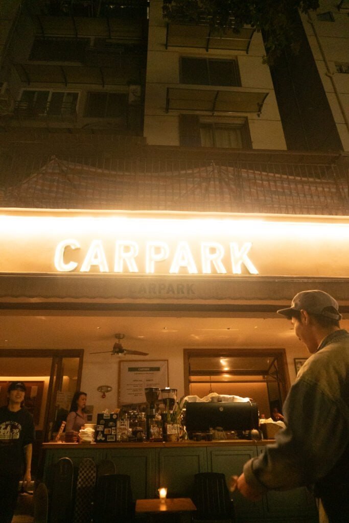 Early evening Chengdu coffee shop carpark sign people street coffee shop china sichuan song a6300