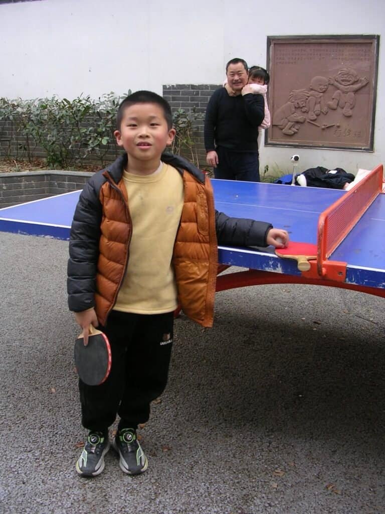 Kit playing table tennis china Chengdu kid man child table tennis table similes daylight